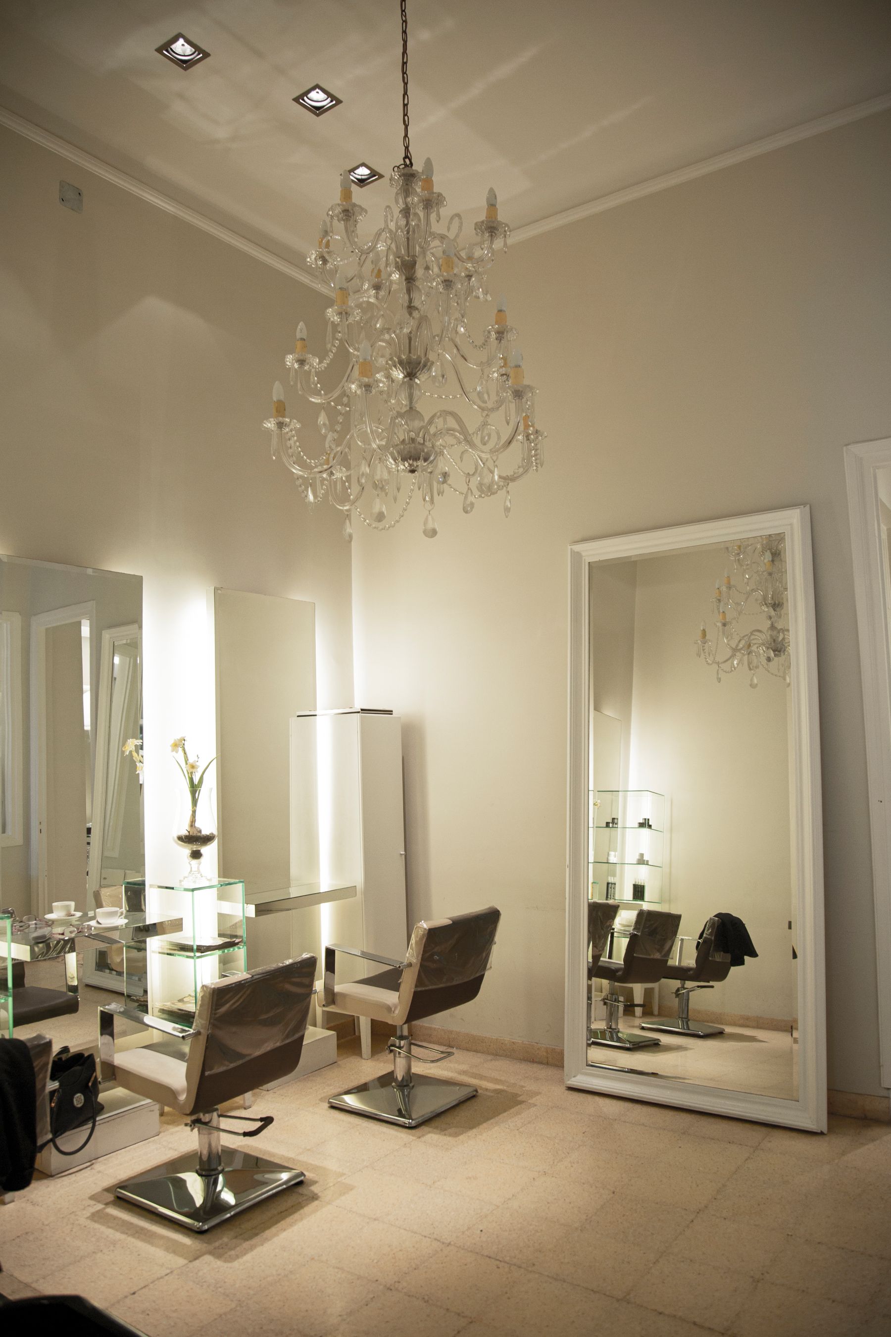 Elegant salon interior with mirrors and a chandelier
